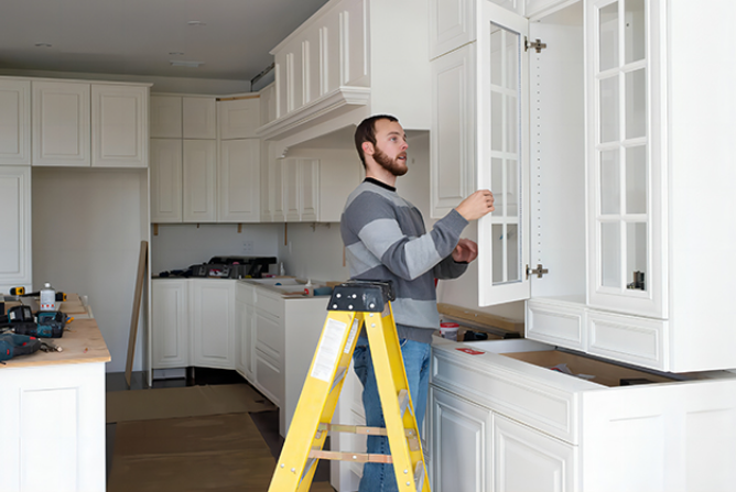 workers are installing rta cabinets-ais